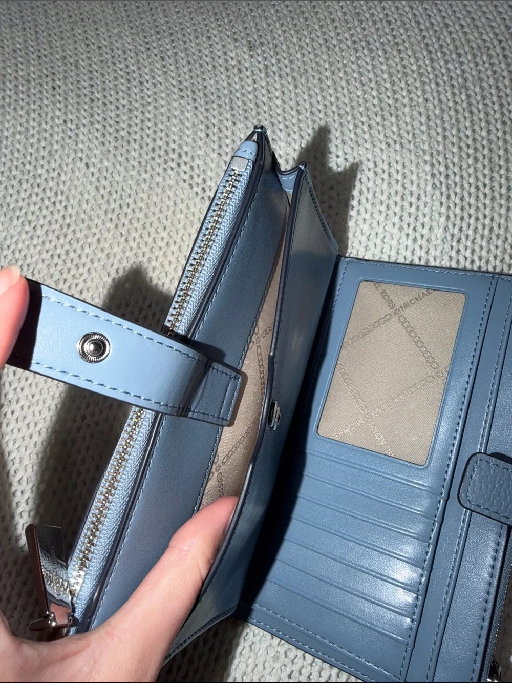 Michael Kors Blue Pebbled Leather Wristlet with silver Logo